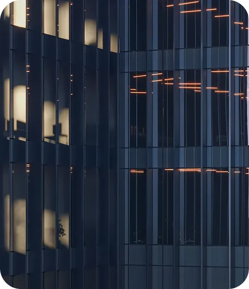 Corporate building with lit windows at dusk